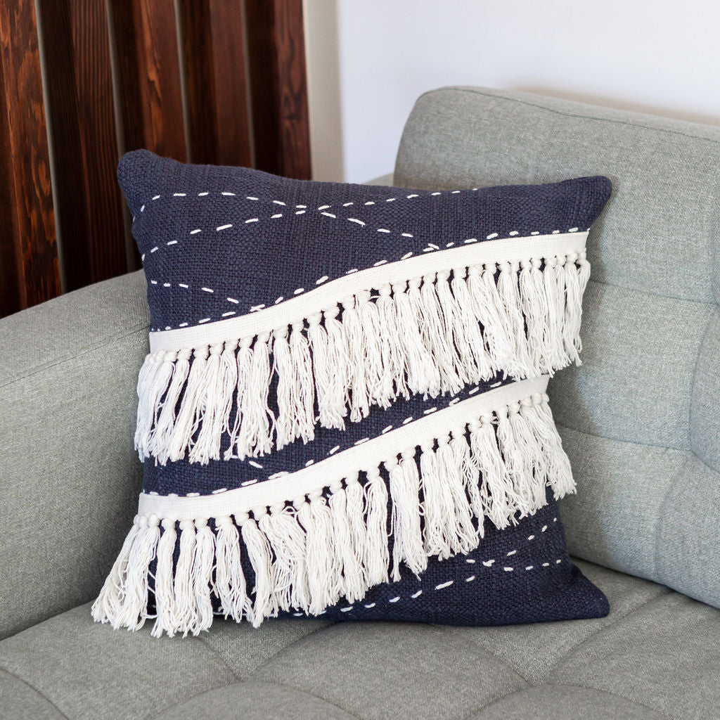 Blue bohemian throw pillow with white tassels for contemporary home decor