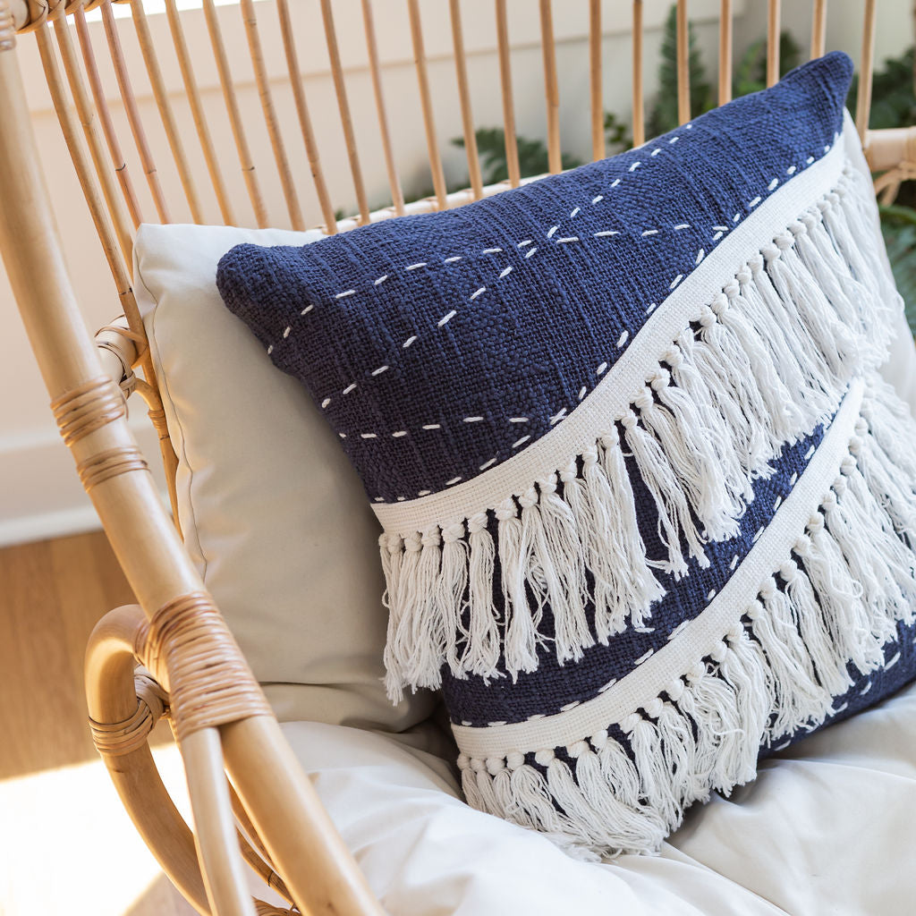 Handcrafted blue chic throw pillow with white tassels for bohemian home decor