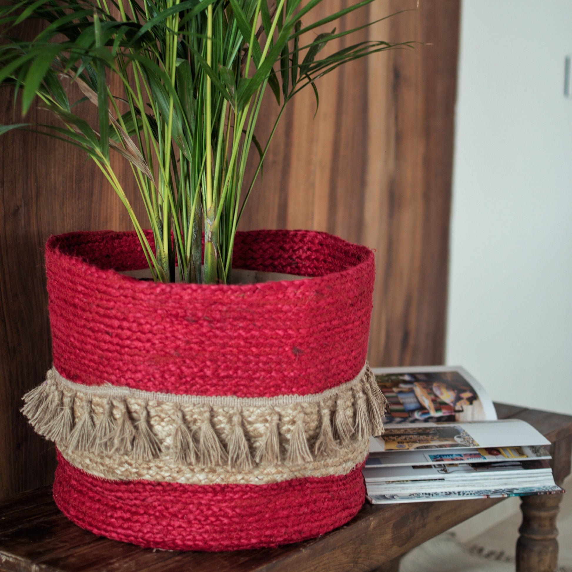Red tasseled handwoven basket for bohemian homes